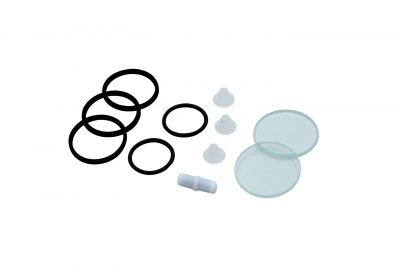 Service set for measuring chamber holder + measuring chamber, with flat seals, O-ring, sight glasses, plugs for measuring chamber and a magnetic stirring bar, front view with all individual parts